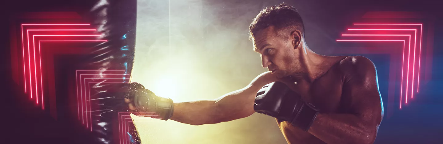 A man hitting a punching bag.