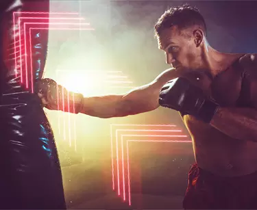 A man hitting a punching bag